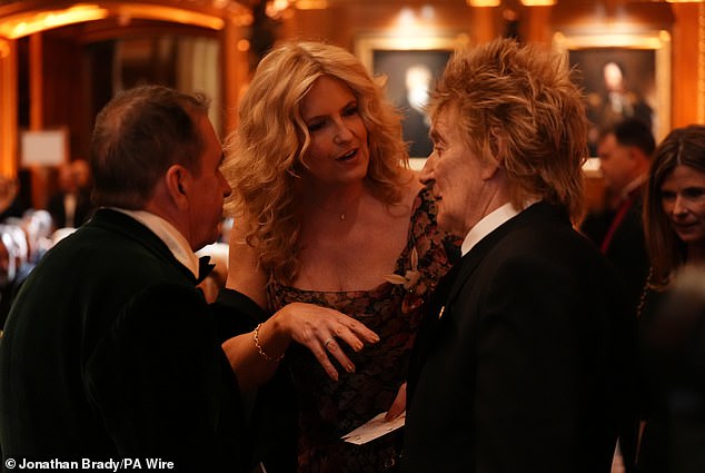 Jools Holland speaks to Lady Penny Lancaster and Sir Rod Stewart before the premiere