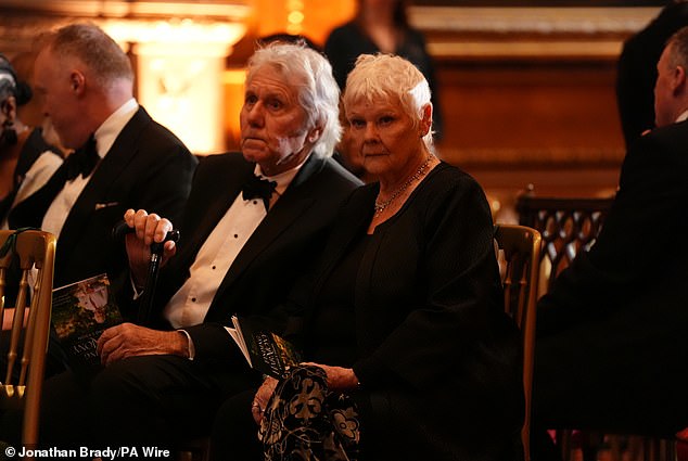 Dame Judi Dench and David Mills are seen before the airing of the film