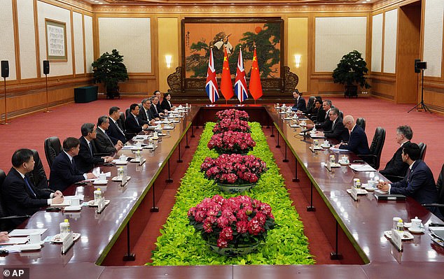 British Prime Minister Keir Starmer, fourth right, and Chinese President Xi Jinping, fifth left, with their delegations participate in a bilateral meeting