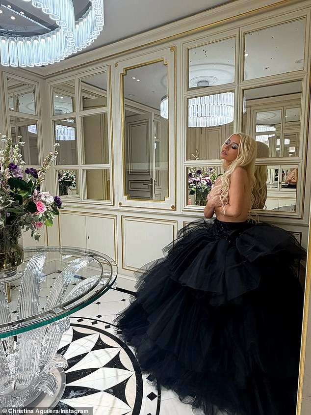 Aguilera posed with her hands cupping her bare breasts