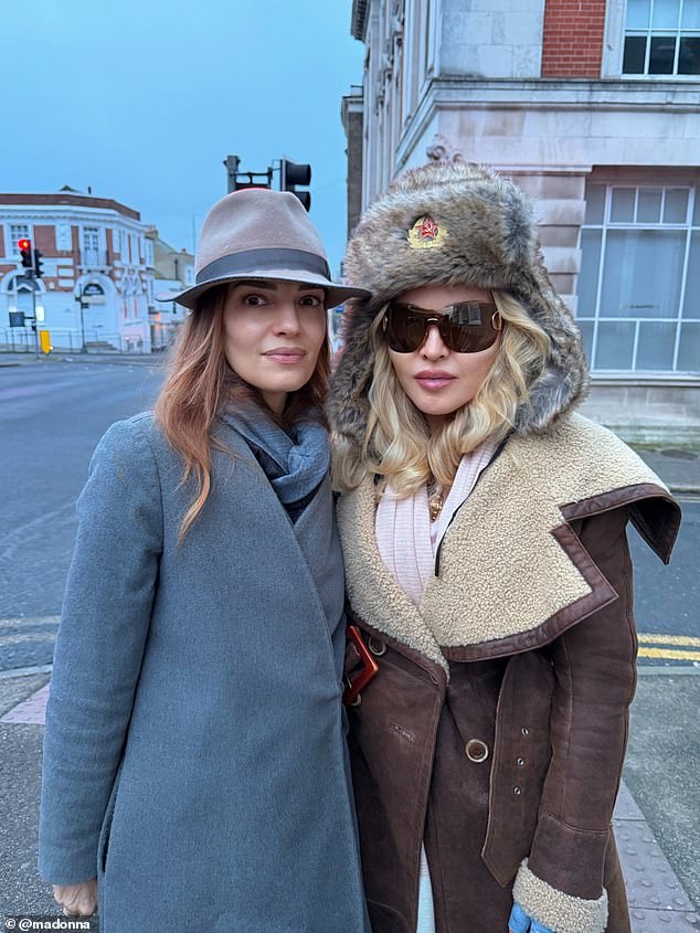 Madonna shared a series of Instagram photos of her trip to the seaside town, posing for snaps with local artists (pictured with her friend Zoe Manzi, a Conde Nast editor)