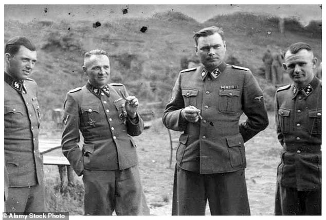SS officers outside Auschwitz. From left to right; Josef Mengele, Josef Kramer, Rudolph Hess and Karl Hoecker
