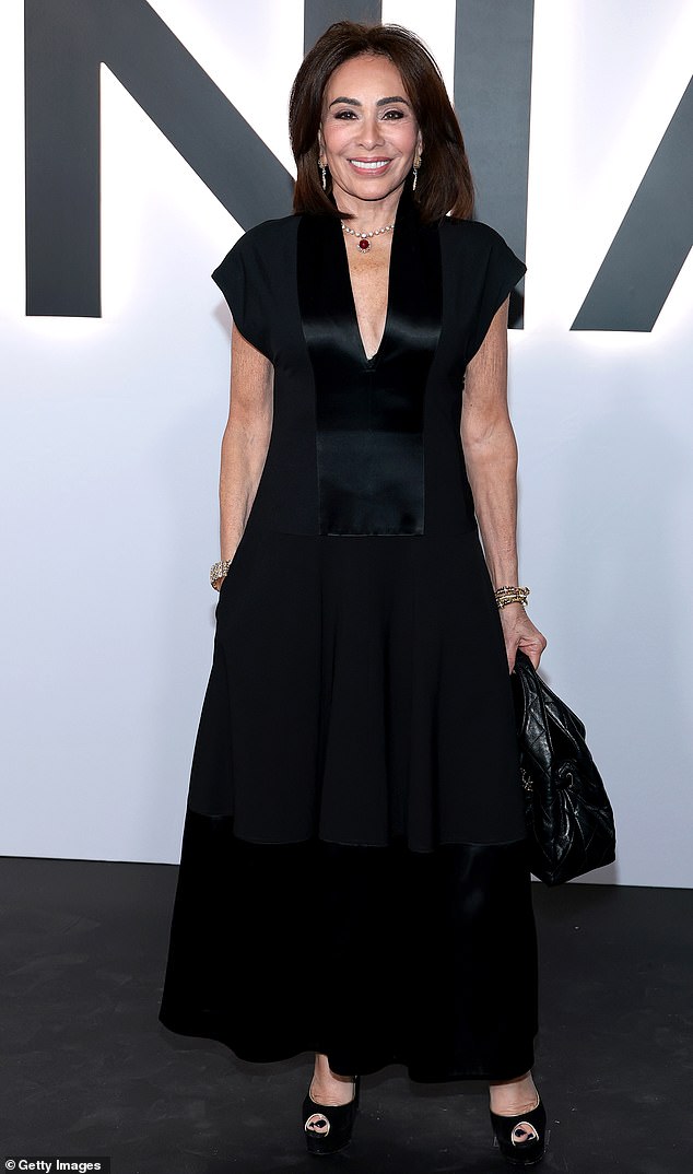 A classic, timeless look! United States Attorney for the District of Columbia Jeanine Pirro kept it stylish and simple for the premiere, wearing a short-sleeve black gown with black satin detailing and a U-shaped neckline. She paired the look with black peep-toe heels, gold jewelry and a black quilted purse. As a finishing touch, she wore a beautiful, ruby-and-diamond necklace