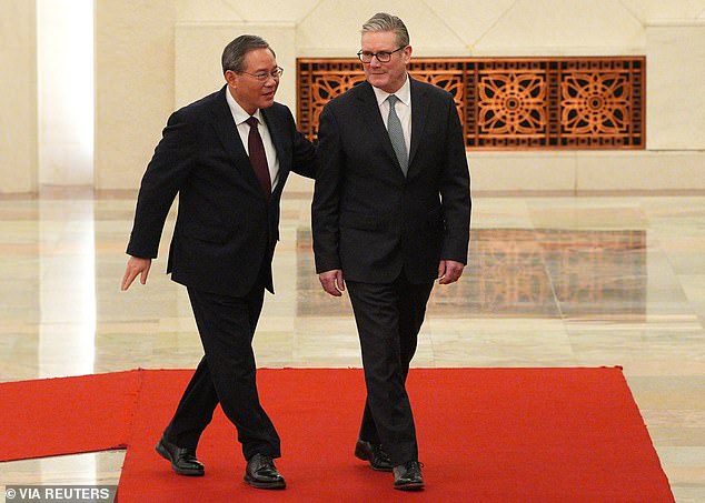 British Prime Minister Keir Starmer walks with Li Qiang, Premier of the People's Republic of China