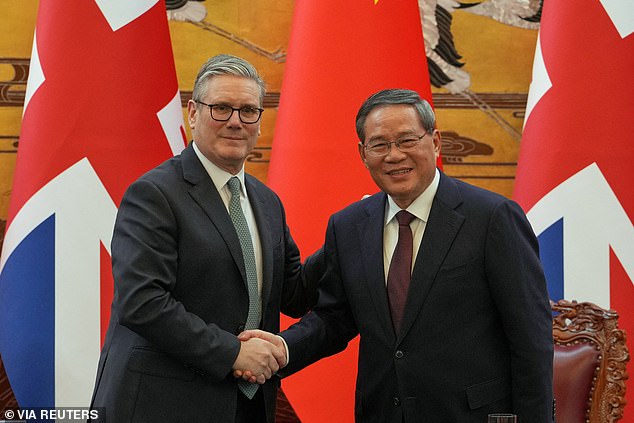 Britain's Prime Minister Keir Starmer and Chinese Premier Li Qiang shake hands after a signing ceremony held at the Great Hall of the People in Beijing, China, Thursday, January 29