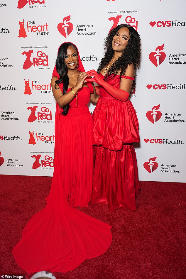 The Grammy-winner, 49, was joined by her look-alike daughter Riley Burruss, 23, who towered over her on the red carpet