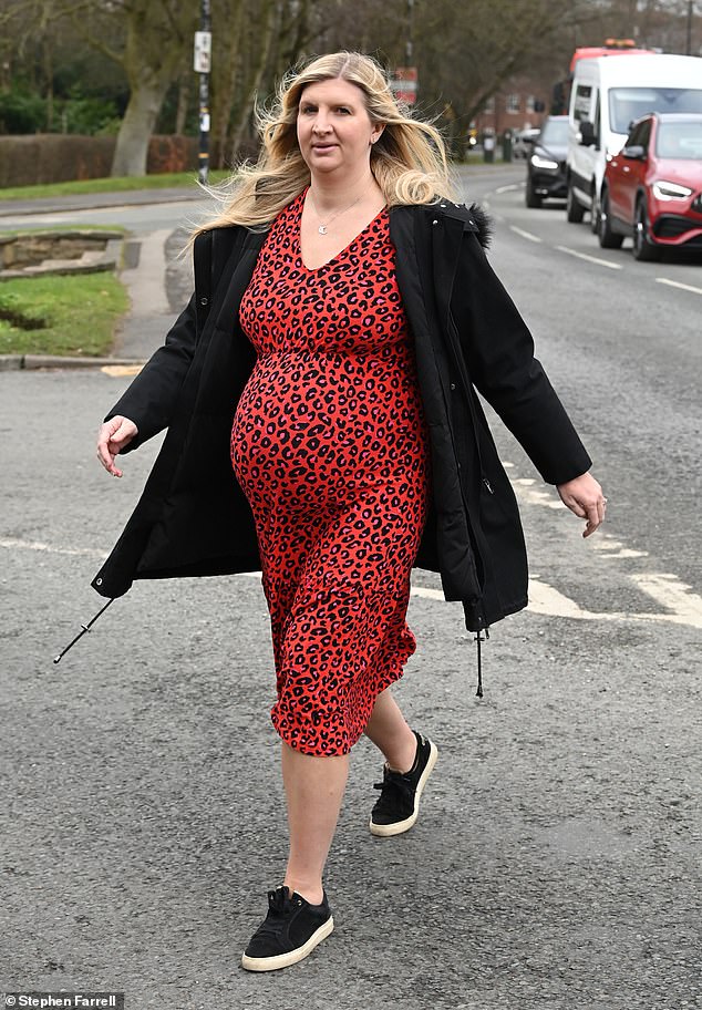 She paired the dress with a black jacket and trainers, while Andy opted for a grey coat, navy zip-up sweater and chinos