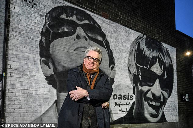 This seat has given us two claims to fame - the phrase 'mad as a hatter' and also the Gallagher brothers of Oasis fame (Pictured: Hardman standing in front of an Oasis mural)