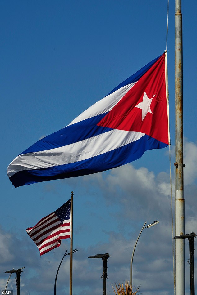 Between 2016 and 2018, over 200 US government employees and diplomats reported experiencing similar symptoms, with the majority of cases linked to staff stationed at the US Embassy in Havana. Pictured are flags in front of the US Embassy