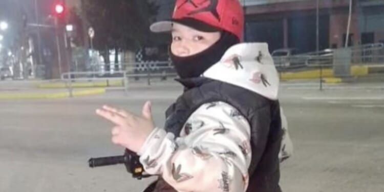 Boy, 12, who posed with guns ‘shot dead by police’ in high-speed chase after suspects opened fire on cops before fleeing