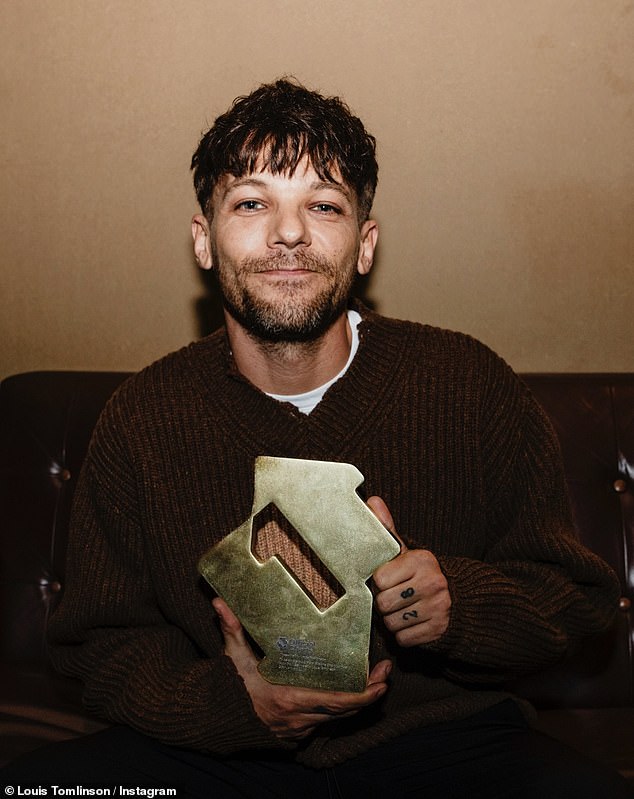 Meanwhile, Harry's former bandmate Louis proudly posed with his award as he thanked fans for all their support