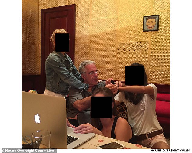 Jeffrey Epstein with three redacted women in an image released by the House Oversight Committee in December