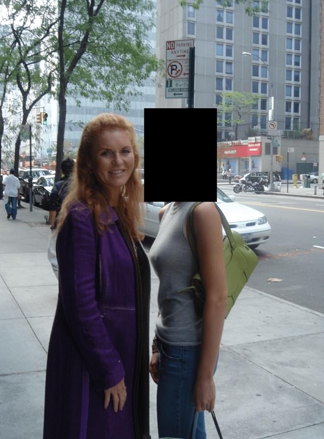 Another picture released last year shows Ms Ferguson posing for a photograph with people on the street