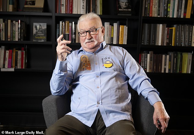 The trade union activist is reportedly recovering from cancer and his paunch strains the buttons of a dated, grey shirt sporting a Ukraine badge and an image of the Black Madonna of Czestochowa, Poland's patron saint