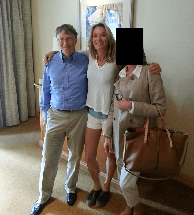 Bill Gates poses with a woman in a photograph released in the Epstein Files on Friday