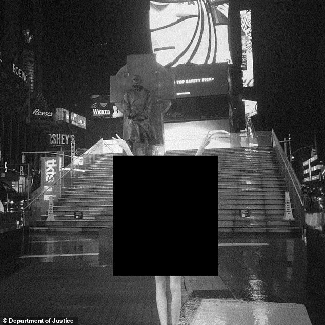 In one of the attachments, an unknown woman poses in front of the Red Steps in Times Square