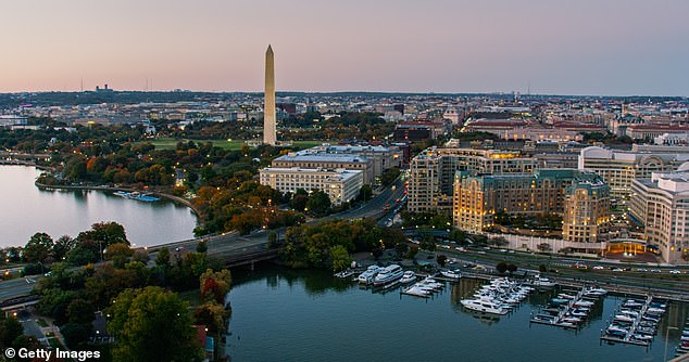 Helicopter shot looking over the Southwest Waterfront towards the Washington Monument in Washington, DC