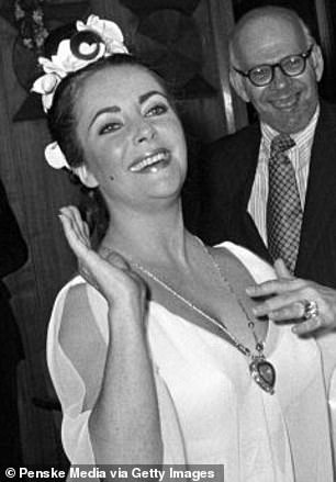 The Oscar nominee, 35, wowed in Taylor's Taj Mahal diamond necklace, which is worth a reported $8 million (pictured: Taylor wearing the necklace in 1972)