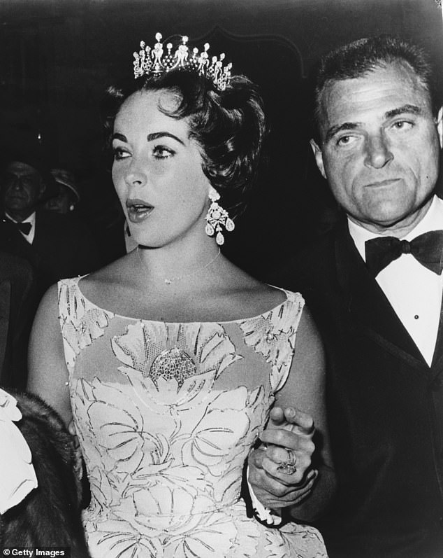 The stunning diamond earrings were given to Taylor by her husband Mike Todd in 1957, shortly before his death in 1958 (Pictured in Los Angeles in February 1958)