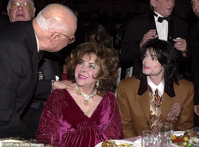 Taylor wears the Massoni monkey necklace and earrings, with Michael Jackson in 2000 at the Carousel of Hope gala. It sold for $290,500 at Christie's