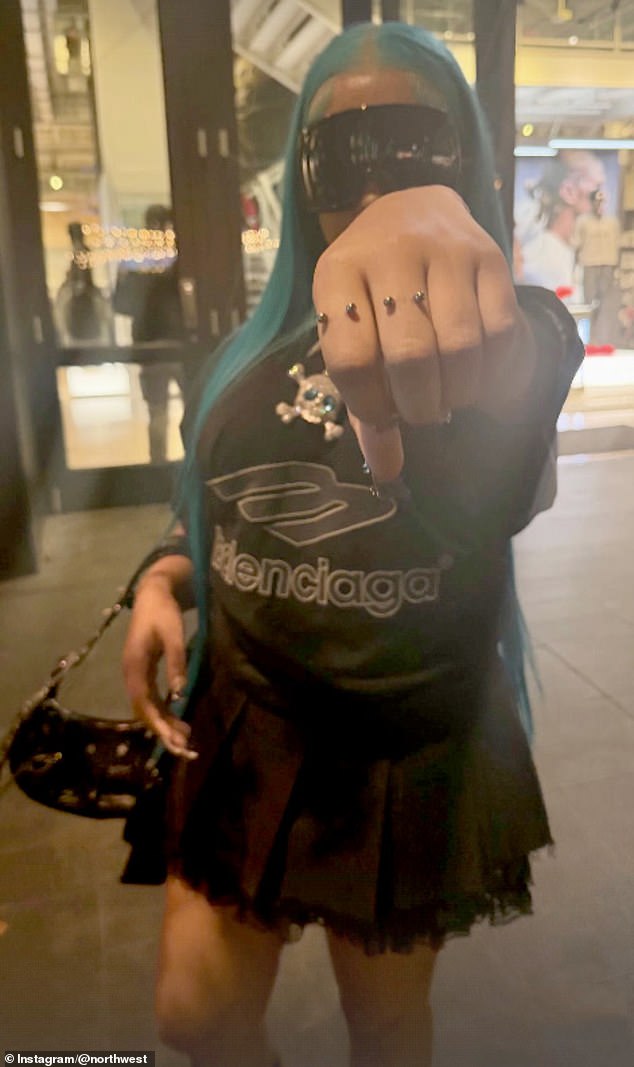 In the new track, North raps: 'Piercing on my hand, the other holding bands, no friends, just filter, you wouldn't understand'