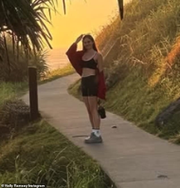 Holly showcased her jaw-dropping figure and incredibly toned abs in a skimpy black and white crop top with matching shorts for a 5am hike