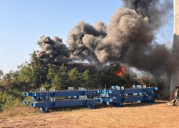 Smoke billowing from the wreckage of a passenger train after a construction crane collapsed onto it in Sikhio district, Nakhon Ratchasima, Thailand, 14 January 2026