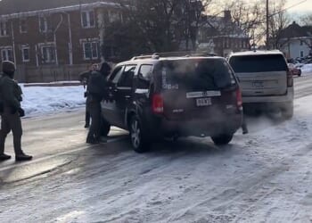 It started as an incident that's increasingly typical across the United States ¿ a shouting match between federal immigration agents and their activist opponents. Pictured: ICE agents approach a vehicle before shooting the driver dead