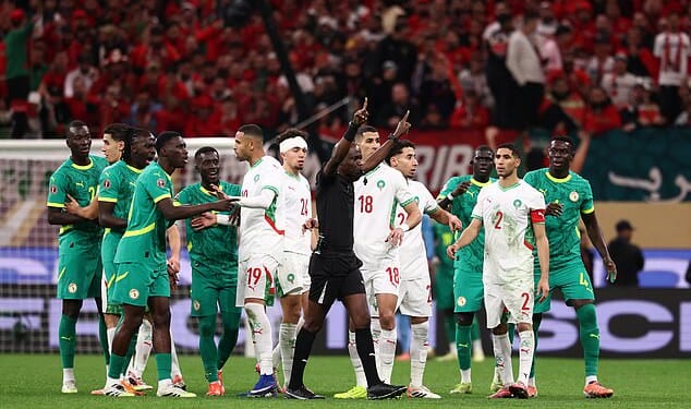 AFCON final descends into CHAOS as Senegal boss calls his team off the pitch after controversial late penalty is awarded to Morocco by VAR