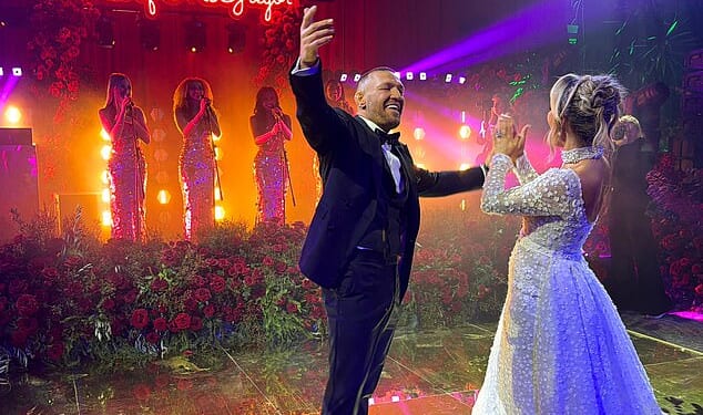 Newlyweds Conor McGregor and Dee Devlin share their first dance at a lavish reception, after tying the knot at the Vatican's Chapel of Santo Stefano degli Abissini in December
