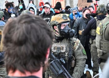 Federal agents confront anti-ICE agitators outside the Bishop Henry Whipple Federal Building in Minneapolis on Jan. 8, 2026.