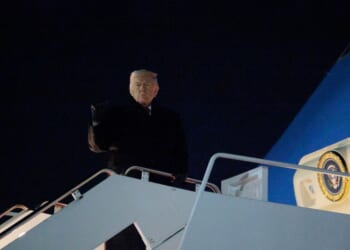 President Donald Trump gestures as he boards Air Force One as he leaves Washington for Switzerland on Jan. 20, 2026, in Joint Base Andrews, Maryland.
