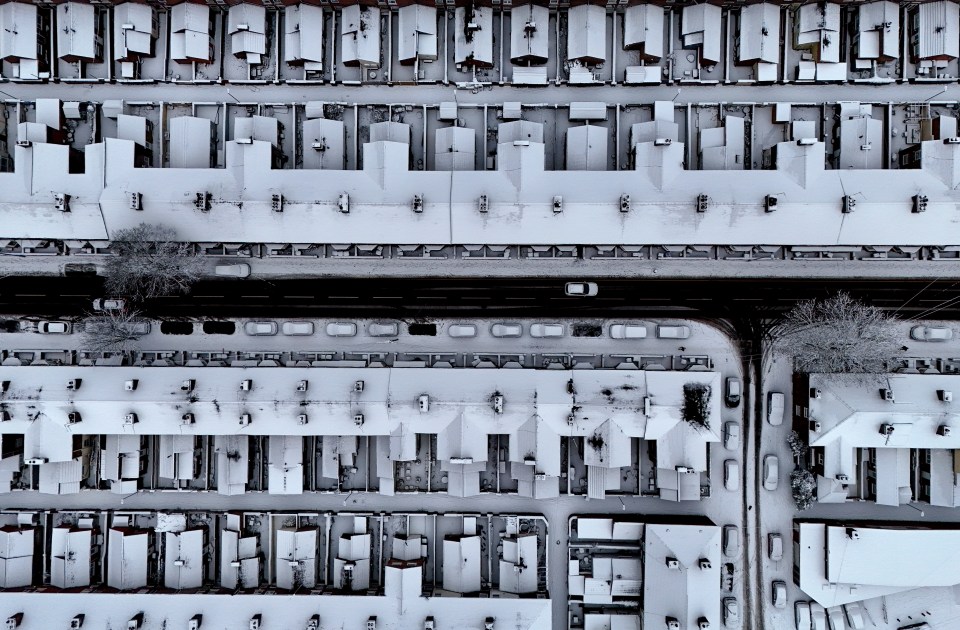 Aerial view of snow-covered terraced houses in Stoke-on-Trent, England.