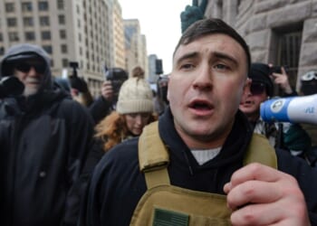 Right wing influencer Jake Lang is confronted by protesters at a rally near city hall on Jan. 17, 2026, in Minneapolis, Minnesota.