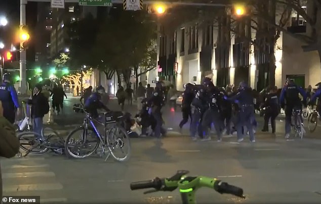 Police on bikes were seen charging into a crowd of agitators near the intersection of S Congress and E 6th streets