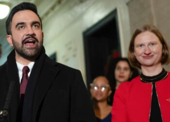 New York Mayor Zohran Mamdani, center, and Cea Weaver, right, the head of his new "Office to Protect Tenants," are seen at a New Year's Day news conference after Mamdani's swearing-in.