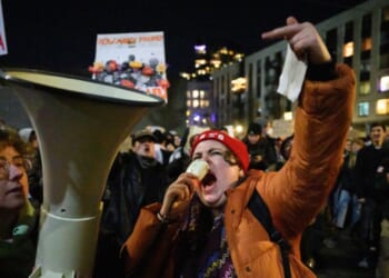 An anti-ICE activist chants and gestures during a protest at the U.S. Immigration and Customs Enforcement facility on Jan. 9, 2026, in Portland, Oregon.