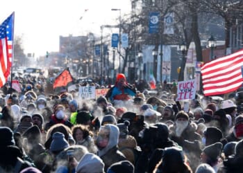 Protesters gather near where a man was shot dead by federal immigration agents in Minneapolis, Minnesota, on Jan. 24, 2026.