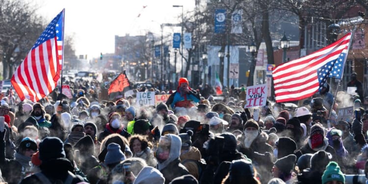 Protesters gather near where a man was shot dead by federal immigration agents in Minneapolis, Minnesota, on Jan. 24, 2026.