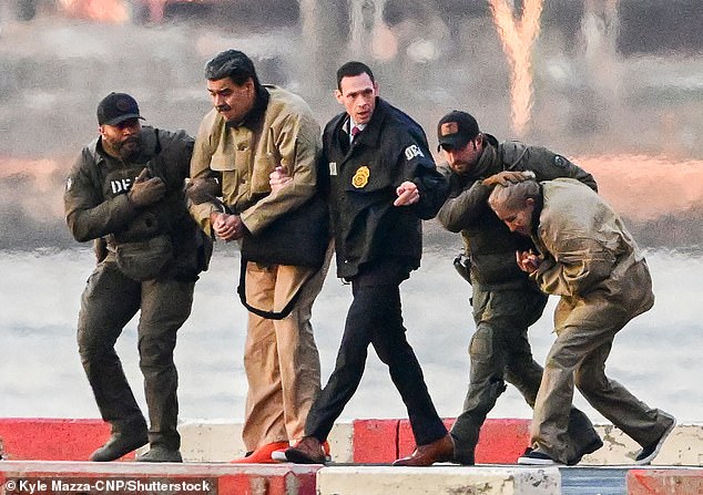 Ousted President Nicolas Maduro of Venezuela and his wife, Cilia Flores, arrive at the Wall Street Heliport in New York City on January 5, 2026