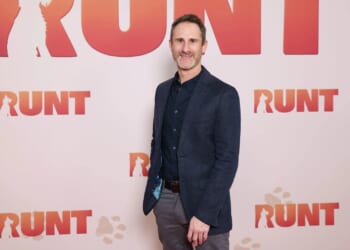 Author charged with child exploitation offences after police raided his home