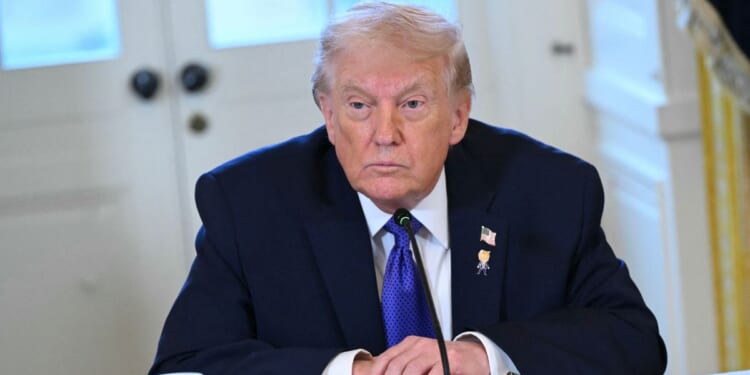 President Trump speaks during a meeting in the White House.