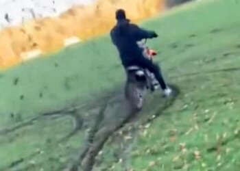 Footage shared on social media shows dirt flying all around as the masked yobs ride around in circles, digging their tyres into the mud