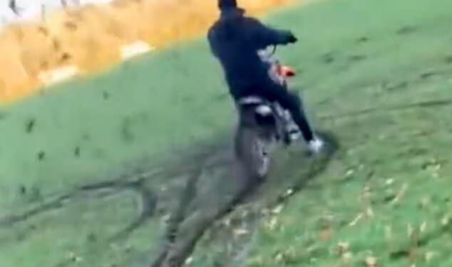 Footage shared on social media shows dirt flying all around as the masked yobs ride around in circles, digging their tyres into the mud