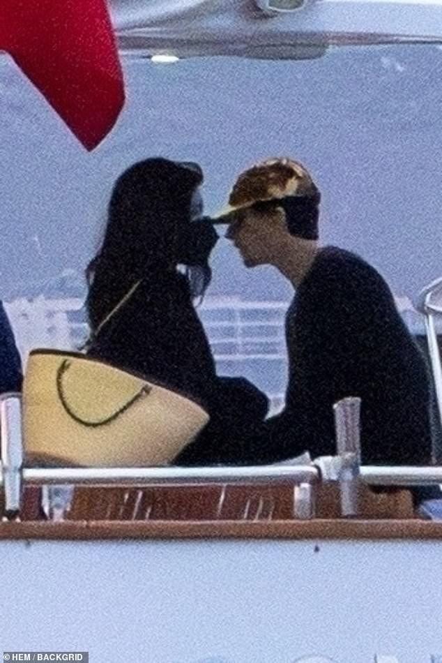 The famously private couple looked more in love than ever as they cozied up at a secluded waterfront property before later stepping out onto a dock and boarding a luxury boat, where they mingled casually with others on board