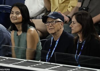 Bill Gates pictured at Melbourne Park in Australia watching the Australian Open with his girlfriend Paula Hurd, just a day after his name was mentioned in the Epstein files