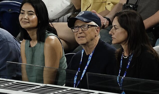 Bill Gates pictured at Melbourne Park in Australia watching the Australian Open with his girlfriend Paula Hurd, just a day after his name was mentioned in the Epstein files