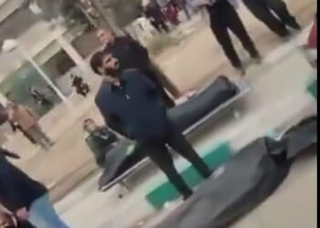 Mourners stand next to body bags outside the Kahrizak Forensic Medical Center in the south of Tehran following the Iranian regime's latest brutal crackdown