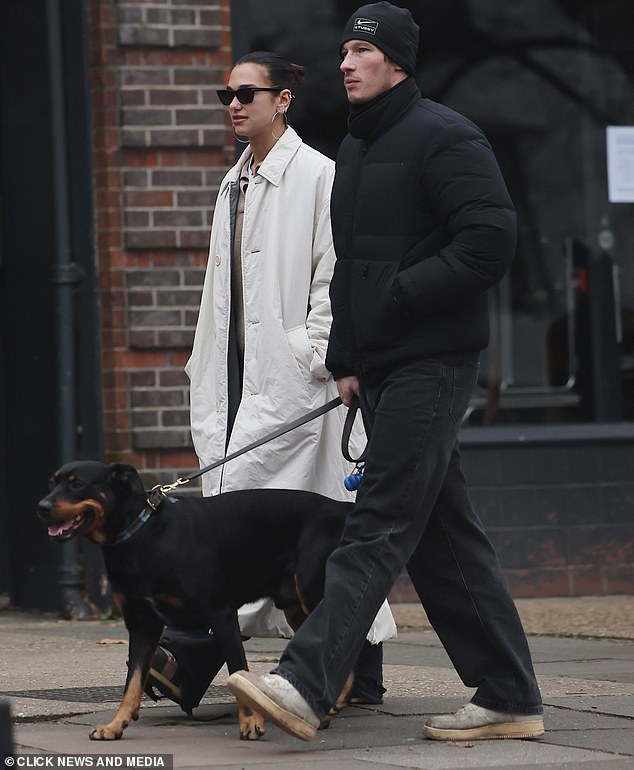 Bond favourite Callum Turner stepped out on a dog walk with his fiancée Dua Lipa this weekend after it was claimed that the 007 job is his and she's tipped to write the theme tune