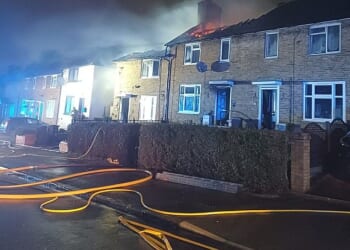 A child and two adults have been rushed to hospital after a fire engulfed a two-storey home in Morden, south-west London